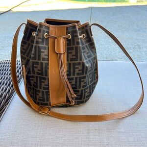 Fendi Mon Tresor Zucca Bucket Bag in brown FF jacquard fabric and tan leather.